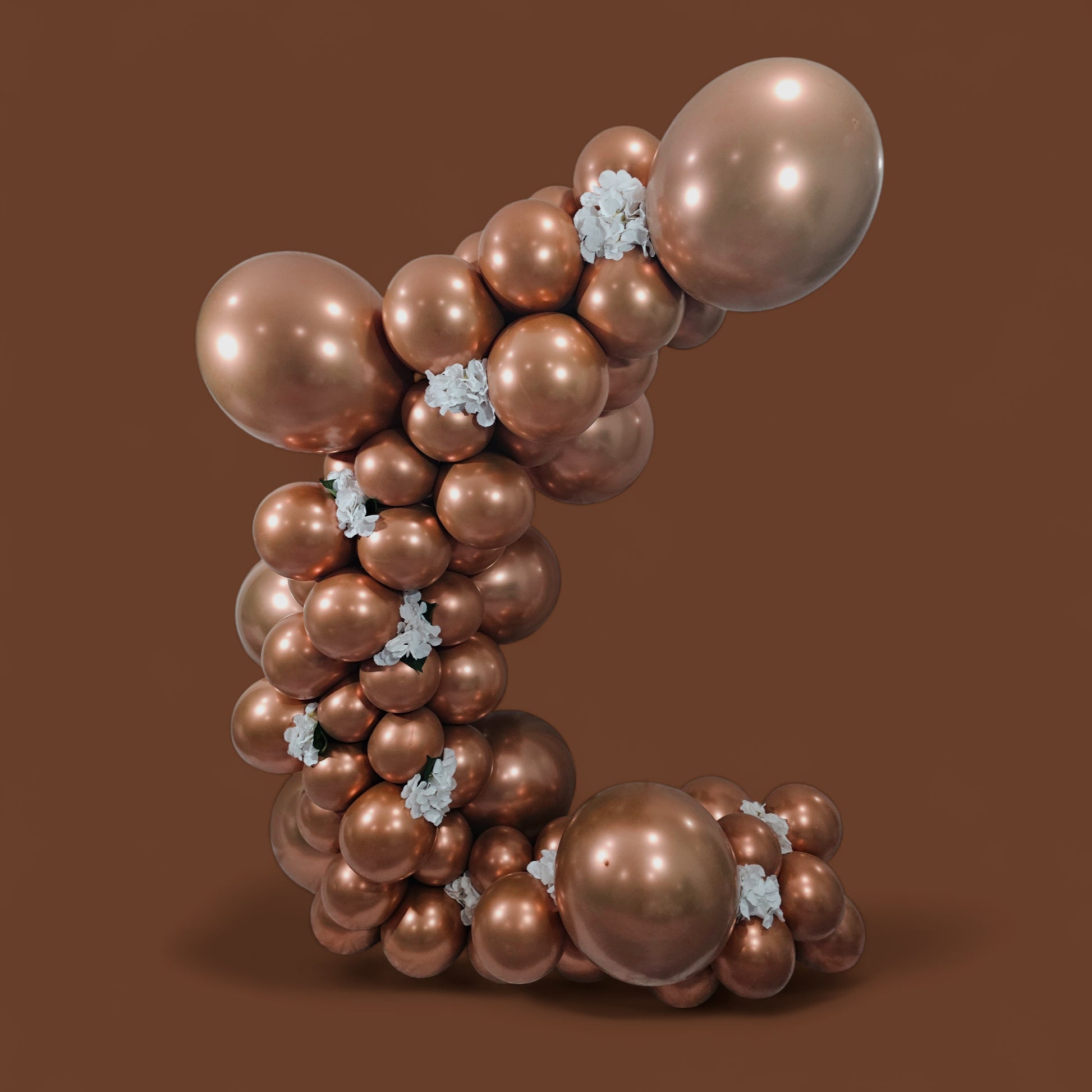 Decorative metallic rose gold birthday balloons